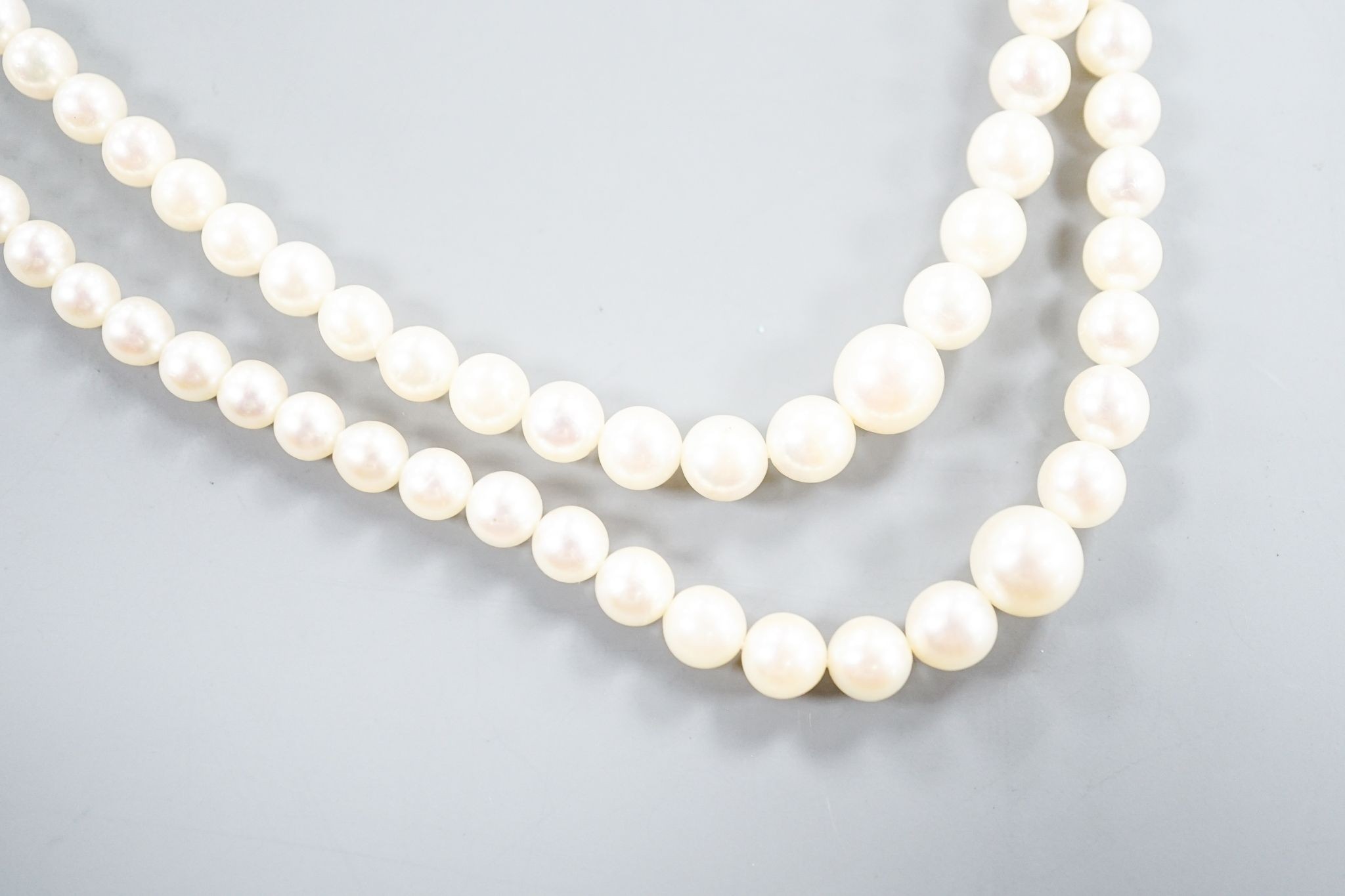 A double strand cultured pearl necklace, with 9ct and cultured pearl cluster clasp, 43cm.